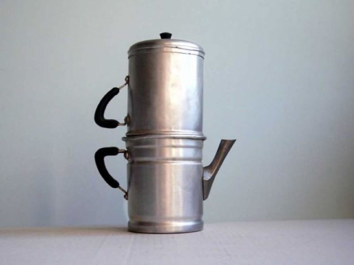 A vintage aluminum cuccuma, the Neapolitan flip coffee pot