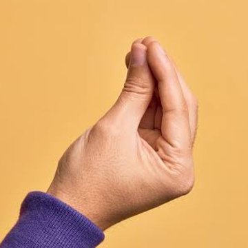 Hand with fingertips pinched together pointing up