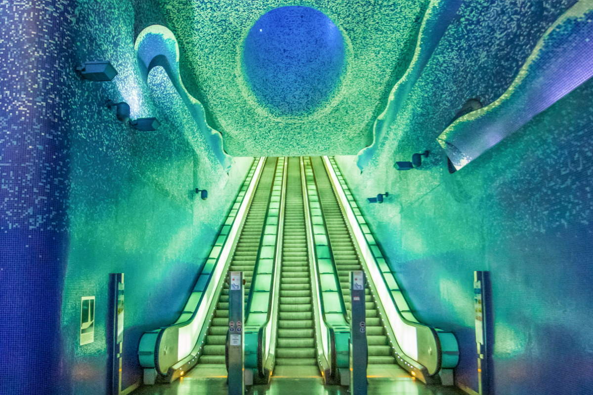 The escalators and blue mosaic ceiling of Toledo metro station in Naples